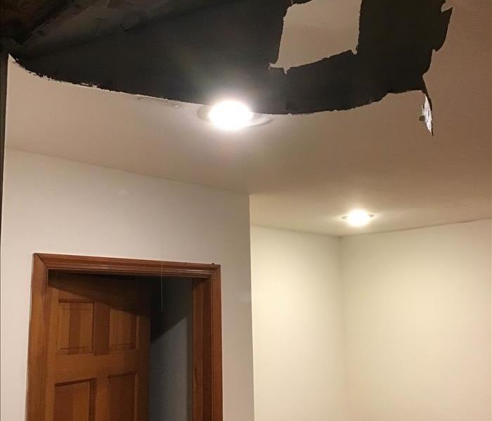 damaged ceiling in a family basement