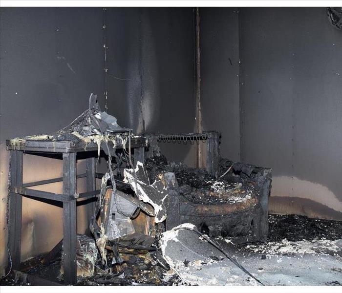 chair and furniture in room after burned by fire
