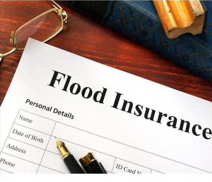 A flood insurance form is shown 